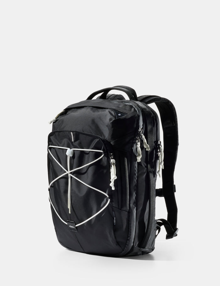 Black backpack with white accents on a light gray background