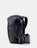 Black backpack with a smaller black pack attached on a white background