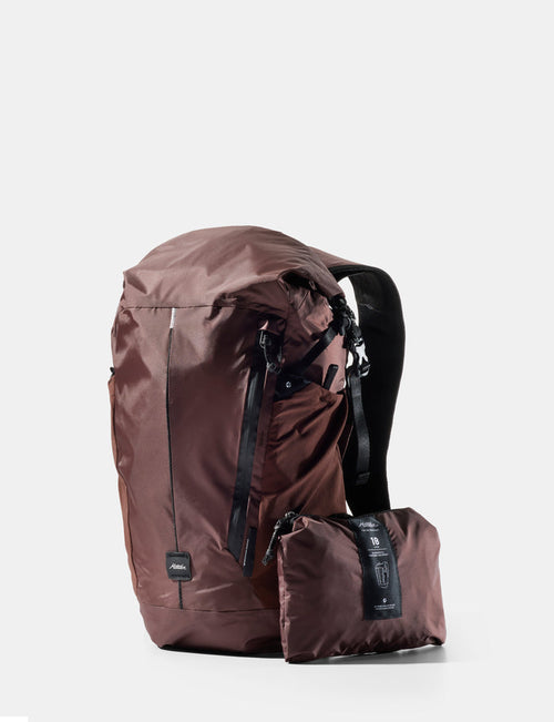 garnet backpack and its compact folding version on a white background