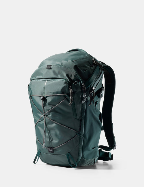 Green backpack on a white background
