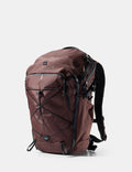 garnet backpack with black straps on a white background