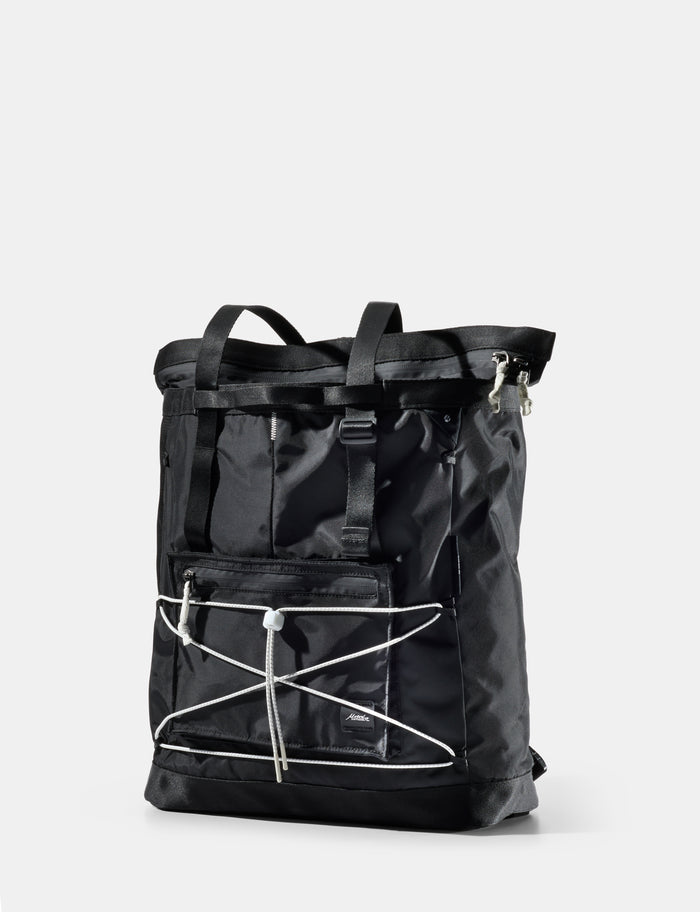 Black tote with white accents on a light gray background