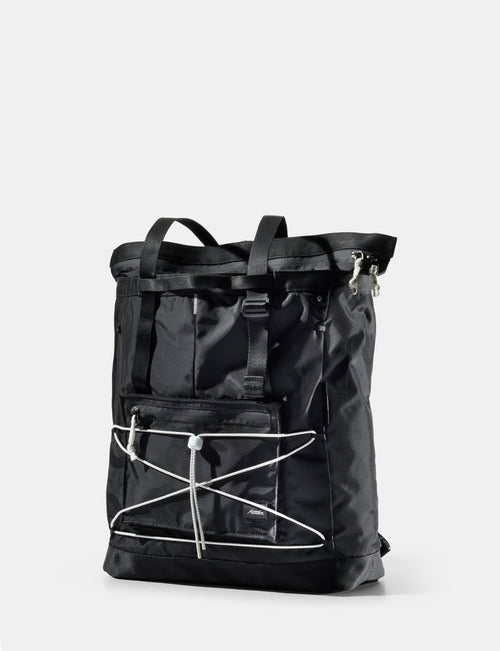 Black tote with white accents on a light gray background