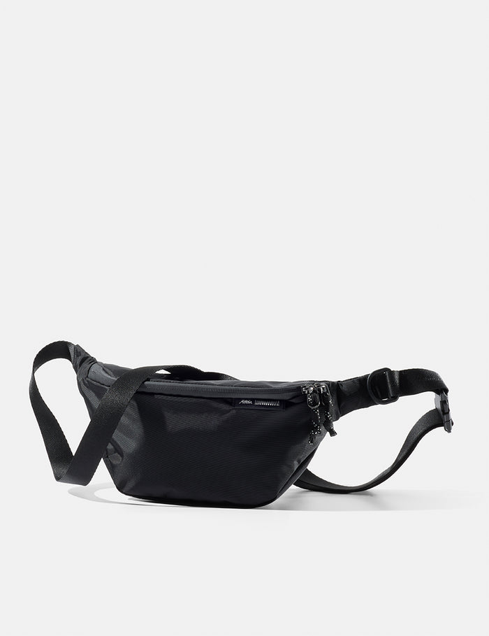 Black waist bag on a white background