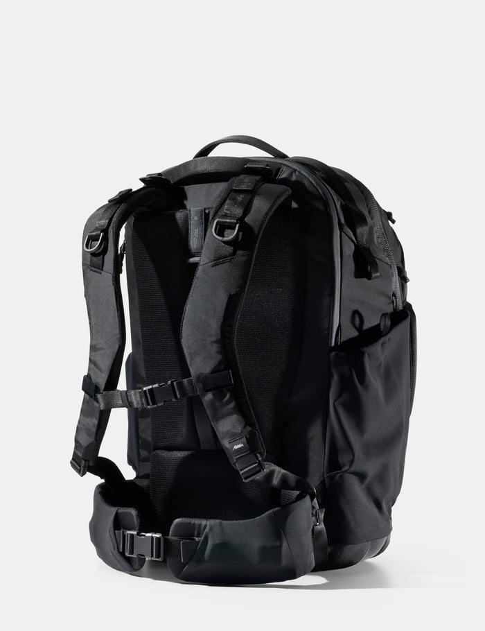 Black backpack on a light gray background