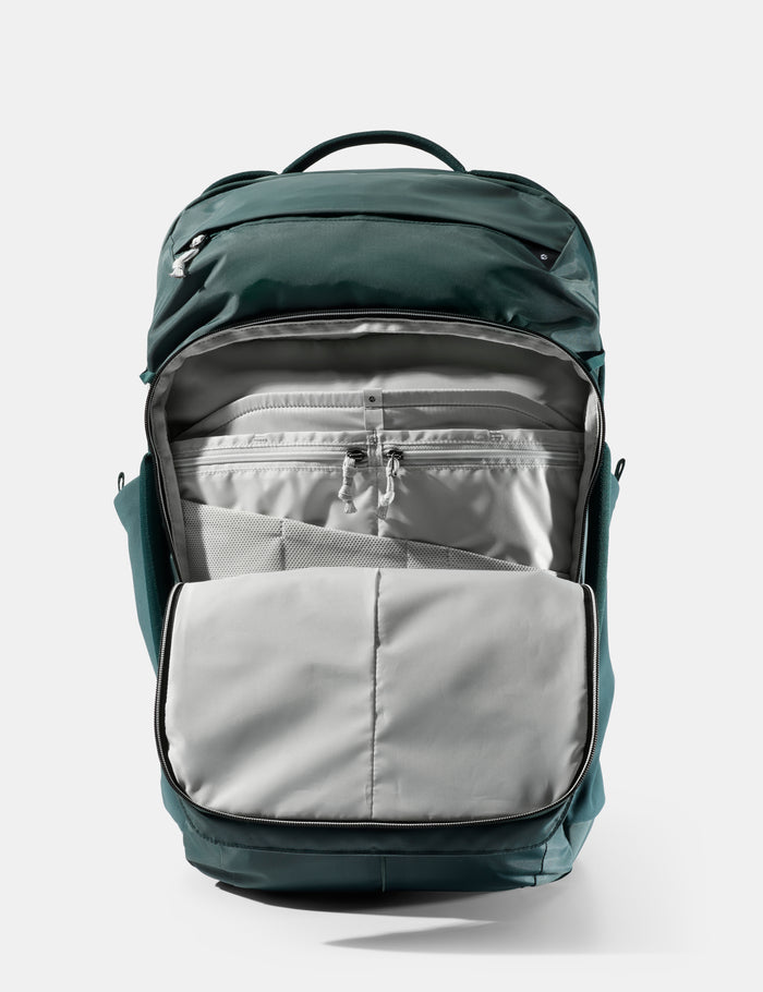 Green and gray backpack on a white background