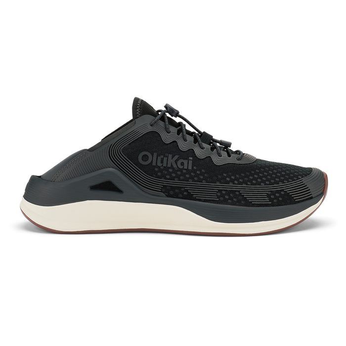 Black OldKai running shoe with white midsole and textured upper, shown in profile view.