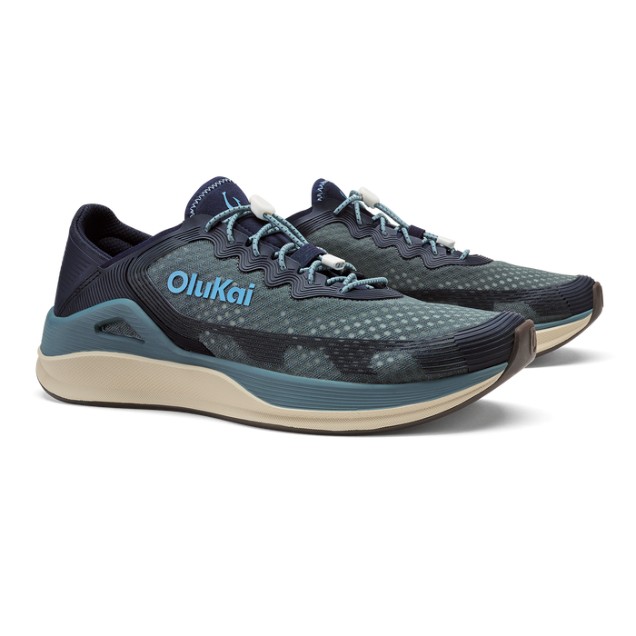 OluKai ʻAhi running shoe in storm blue and trench blue with light blue accents and cream sole.