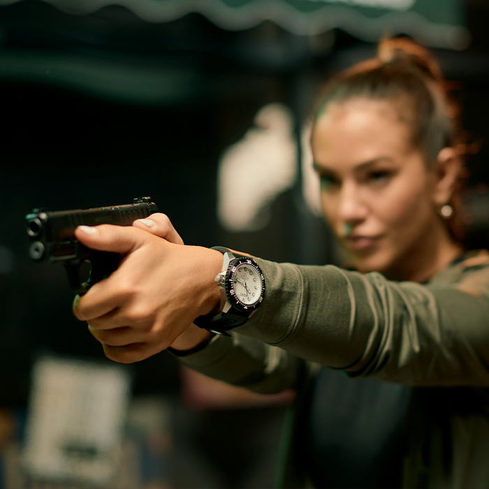 Person Aiming and Wearing Kore Essentials Altitude Field Watch on Wrist
