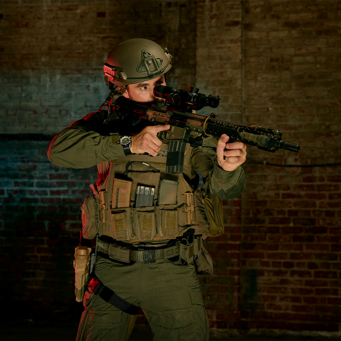 Police Officer in Tactical Gear Wearing a Kore Essentials Ranger Green Molle Battle Belt with Kore Essentials Attachments Equipped to the Belt