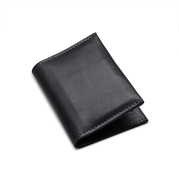 Side View of Kore Essentials Leather Bifold Wallet on a White Background