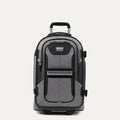 front view of the gray black bold by travelpro carry-on expandable rollaboard suitcase standing upright, showcasing its rugged black and gray polyester exterior, front zippered pocket, sturdy top carry handle, and extended telescoping aircraft-grade handle.