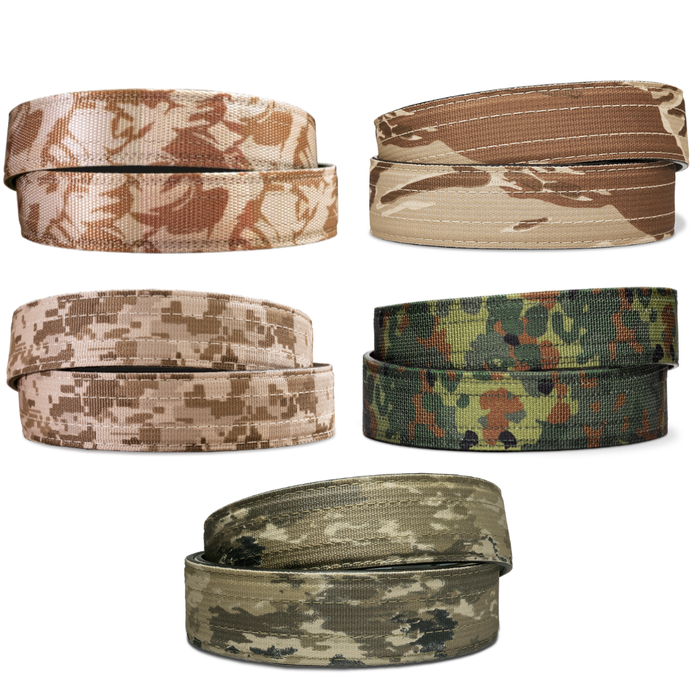 A collection of Kore Essentials Limited Edition Camp tactical gun belts on a white background. Displayed is a  desert tiger stripe tactical belt, a desert DPM tactical belt, flektarn tactical belt, desert digi tactical belt and an ATACS tactical belt.