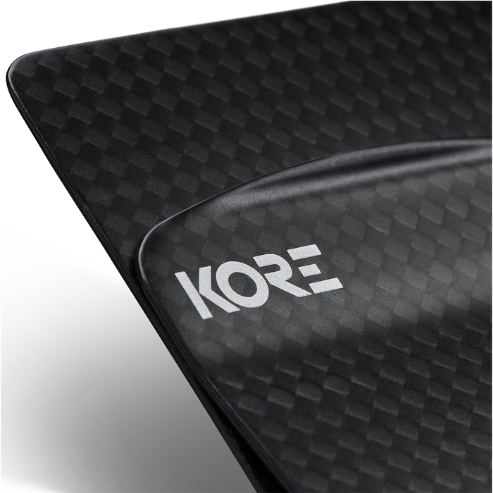Closeup Shot of a Kore Essentials Carbon Fiber Money Clip on a White Background