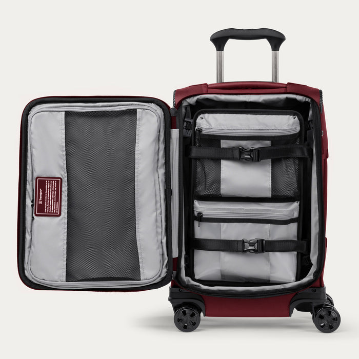 Interior view of the Crew™ Classic Carry-on Spinner in Rosewood Red, showcasing built-in accessory compartments and compression straps for organized packing.