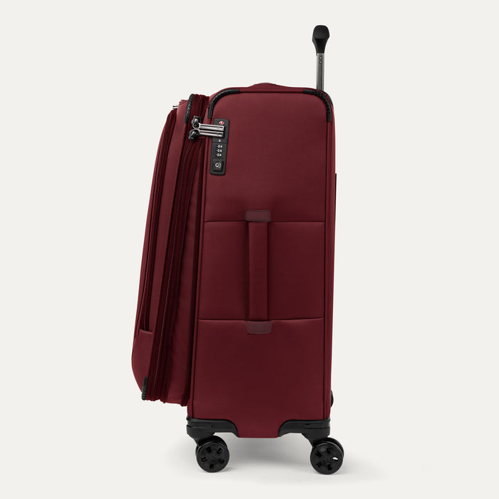 Side view of the Crew™ Classic Spinner in Rosewood Red, featuring a telescoping handle, side carry handle, integrated TSA-approved lock, and spinner wheels.