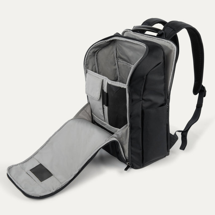 Open interior view of the Crew Executive Choice 3 Slim Laptop Backpack, highlighting the padded laptop and tablet sleeves alongside multiple interior organizational pockets for efficient packing.