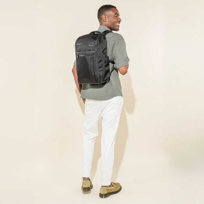Rear view of the Crew Executive Choice 3 Slim Laptop Backpack in Black, demonstrating the backpack's comfortable fit and ergonomic design while being worn.