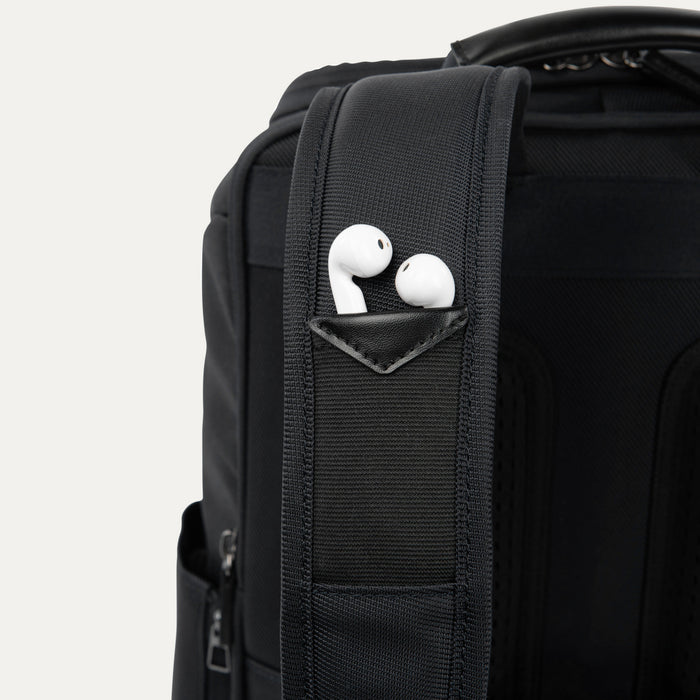 Close-up detail view of the dedicated strap pocket on the Crew Executive Choice 3 Slim Laptop Backpack, showcasing the convenient, secure storage designed for earbuds or small accessories on the go.