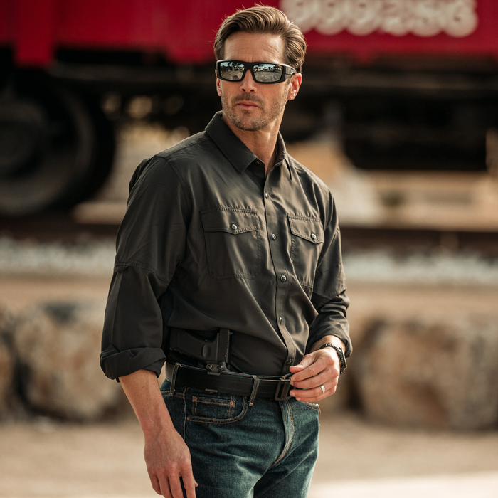 Person wearing a black nylon 1.5" gun belt for EDC and concealed carry from Kore Essentials.