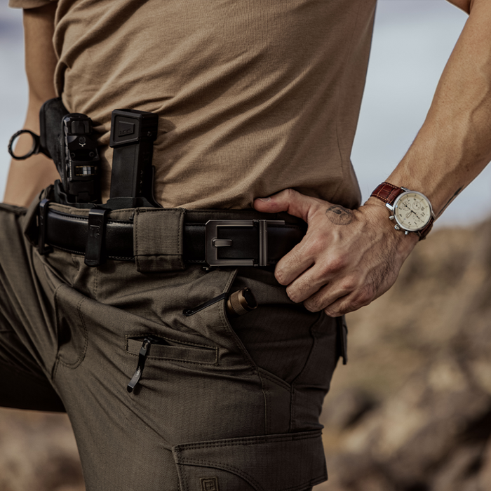 Man Wearing a Kore Essentials Black Leather Gun Belt with an X3 Buckle