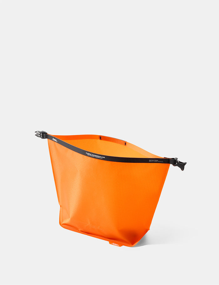 Open Orange toiletry bag on a white background