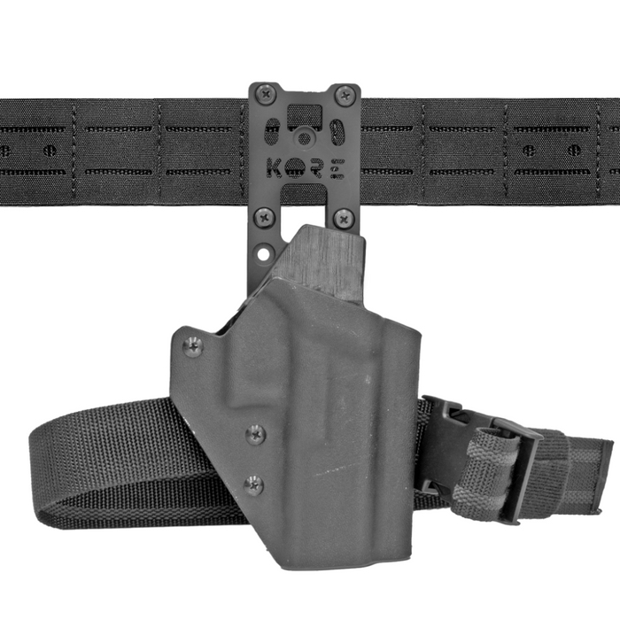 Front view of black Kore Essentials Holster Mount kit attached to laser cut molle battle belt