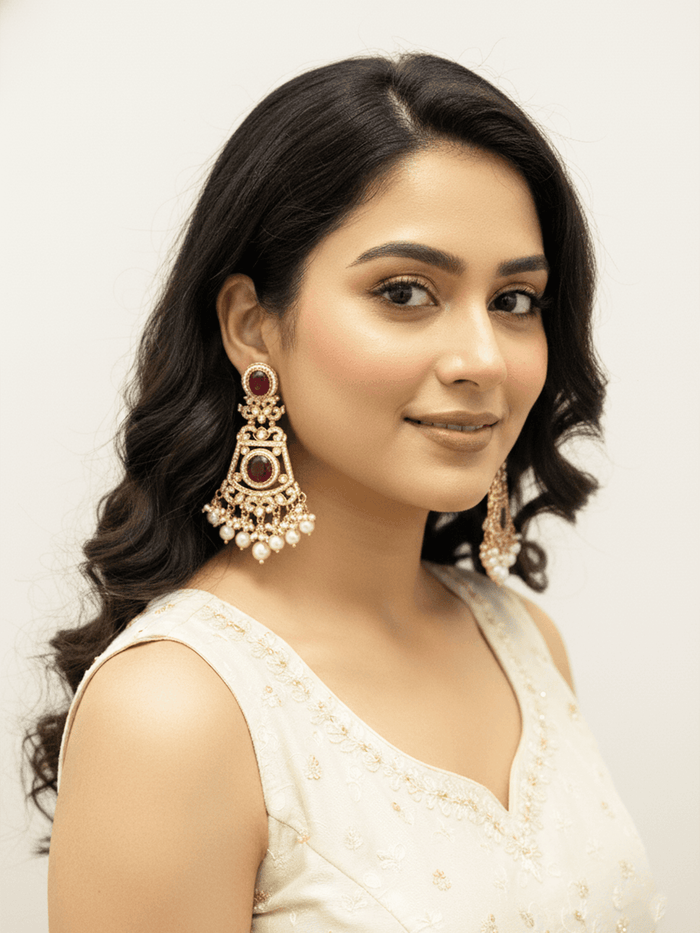 Intricate Kundan Jhumkas With Maroon Stones.