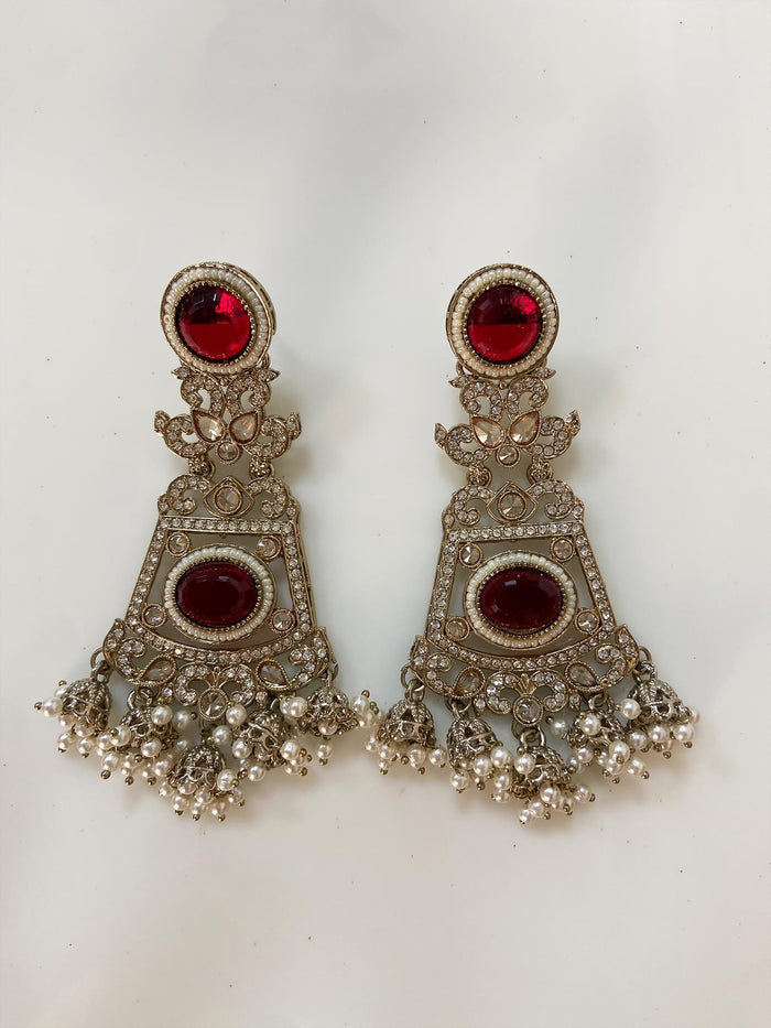 Intricate Kundan Jhumkas With Maroon Stones.
