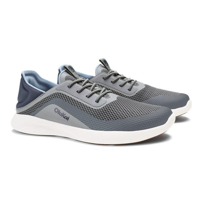 Charcoal and gray mesh athletic shoe with white sole and dark laces.