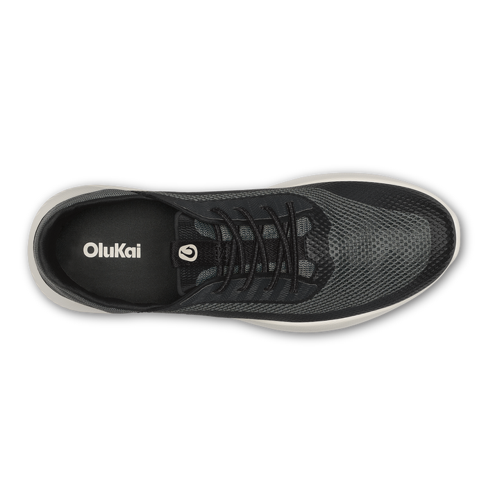 Dark gray and black mesh sneaker with black laces and white sole, shown from above.