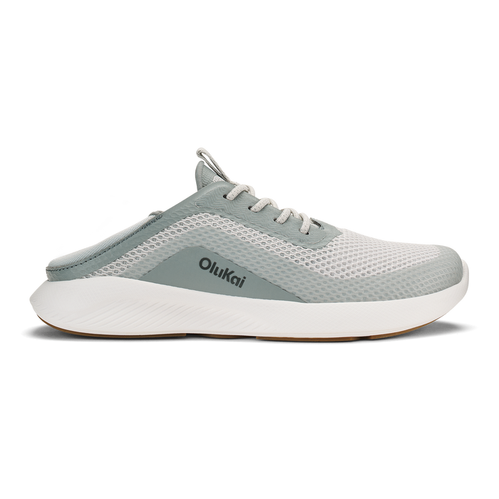 Gray and white Olukai slip-on athletic shoe with mesh upper and white cushioned sole.