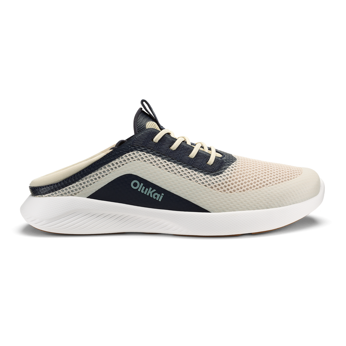 Beige and navy mesh sneaker with white sole, black heel panel, and tan laces, shown from the side.
