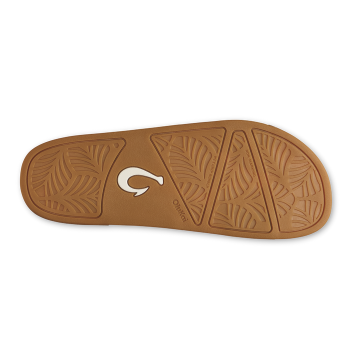 Toffee-colored sandal sole with geometric leaf pattern and white logo detail.