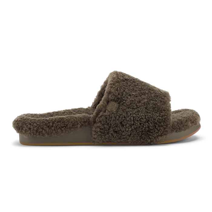 Walnut fuzzy slide slipper with twisted knot detail and tan sole, shown in profile view.