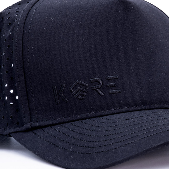 Closeup of Kore Essentials Black Coast Hat with Black Kore Logo