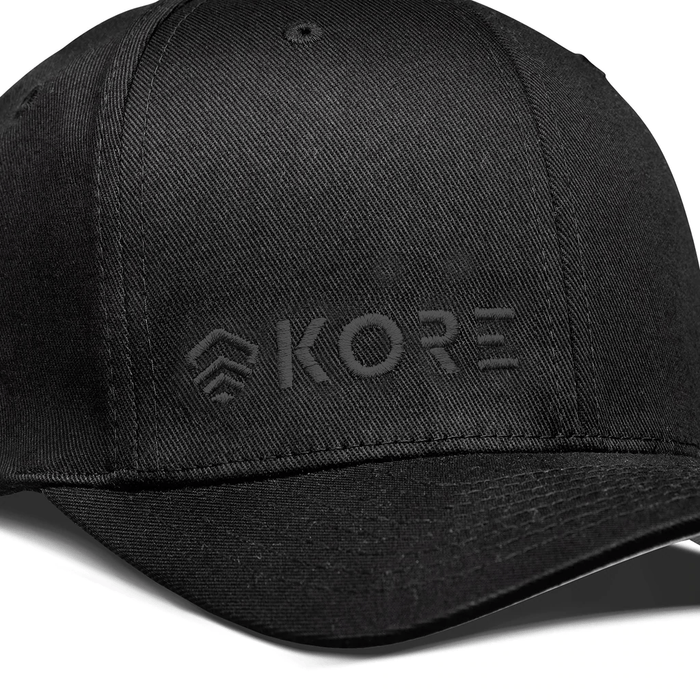 Closeup View of Kore Essentials Black FlexFit® Baseball Cap with Black Kore Logo