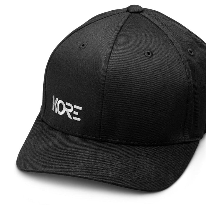 Upper Left Frontside View of Kore Essentials Black FlexFit® Baseball Cap with White Kore Logo