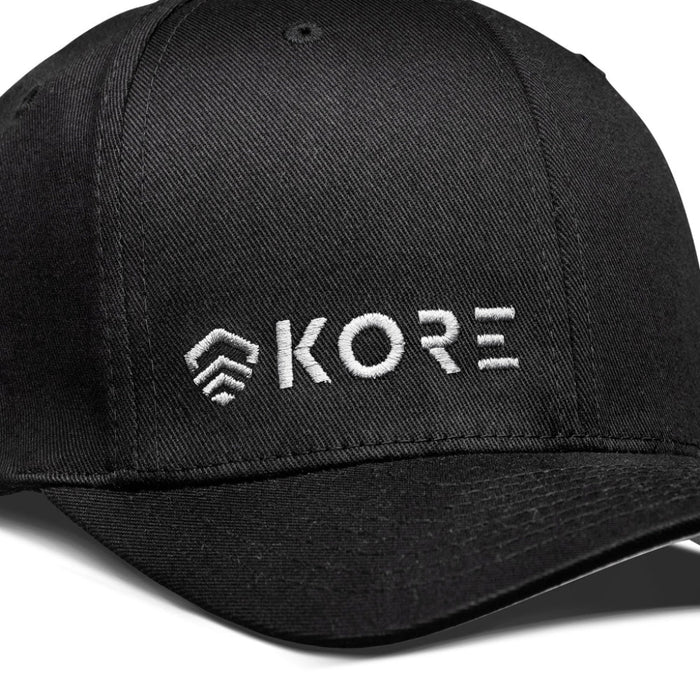 Closeup View of Kore Essentials Black FlexFit® Baseball Cap with White Kore Logo