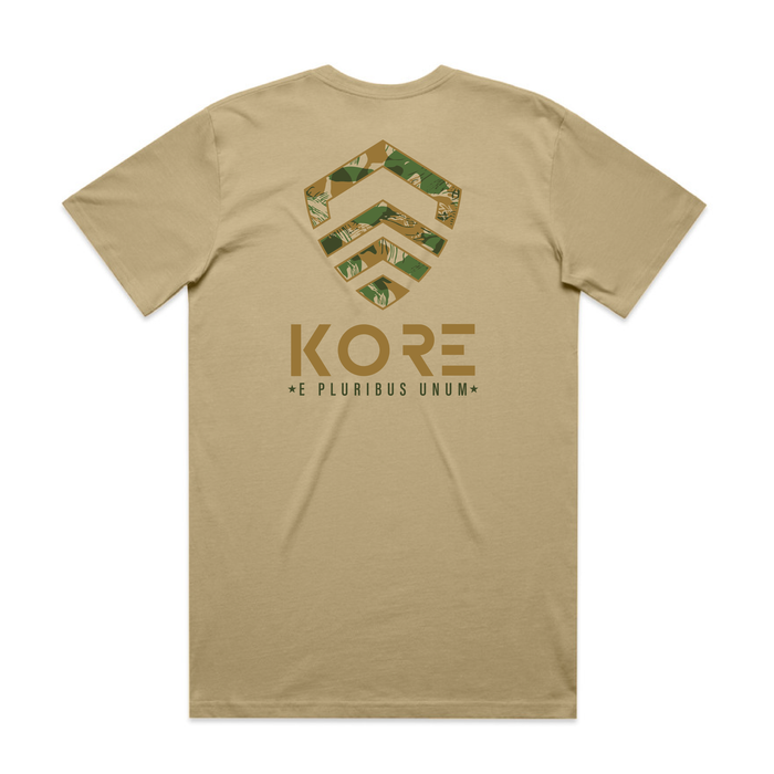 Back of beige t-shirt with a geometric design and 'KORE' branding on the back.