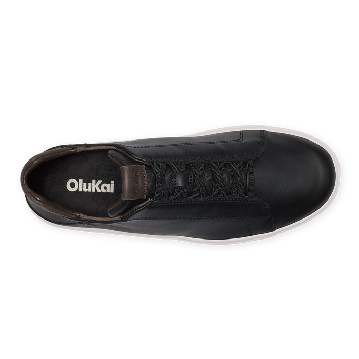 Black high-top sneaker with dark brown heel collar and white sole, shown from above.
