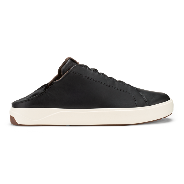 Black leather slip-on shoe with cream rubber sole and brown heel accent.
