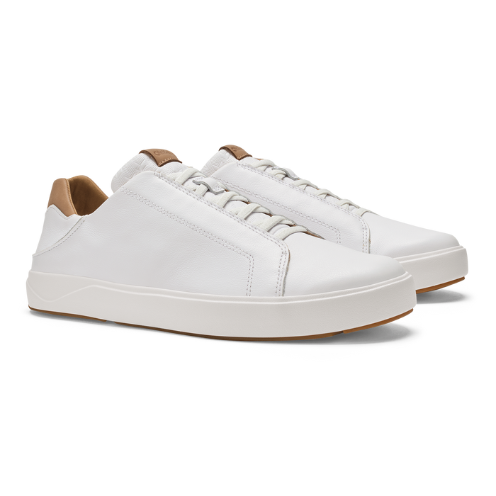 Pair of white leather lace-up sneakers with tan heel tabs and white platform soles.