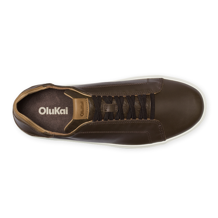 Dark brown leather sneaker with tan suede heel collar, black laces, and white sole, viewed from above.