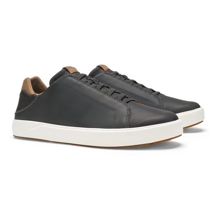Black leather lace-up sneaker with tan collar trim and cream rubber sole.