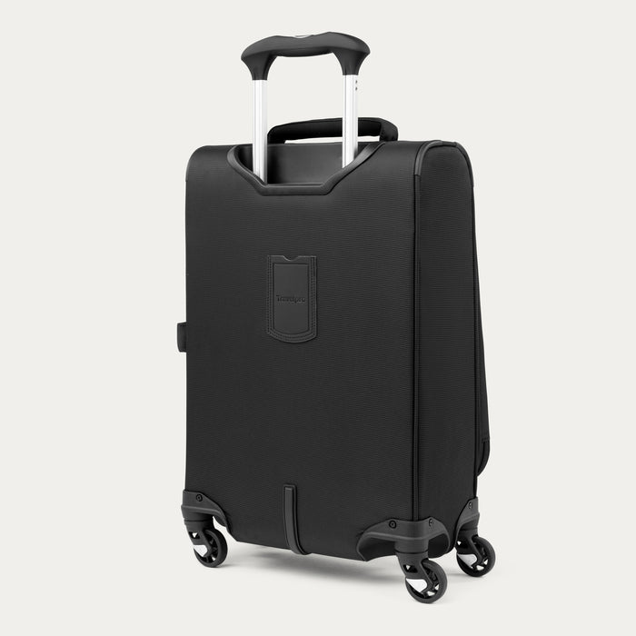 rear view of black travelpro maxlite 5 compact carry-on spinner showing the integrated id tag holder and bottom wheel housing.
