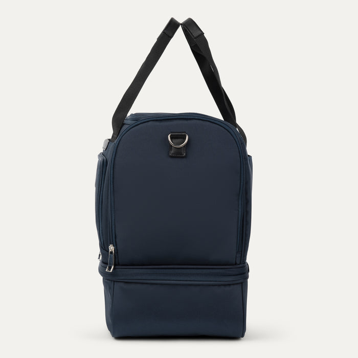 side profile view of midnight blue travelpro maxlite 5 drop bottom weekender showing the side zippered pocket and shoulder strap attachment point.