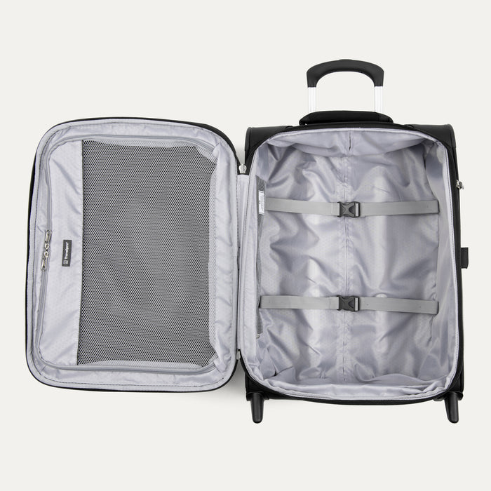 interior view of the open black travelpro maxlite 5 international carry-on rollaboard showing the light gray ecofab lining, a large mesh zippered lid pocket, and adjustable hold-down straps in the main compartment.