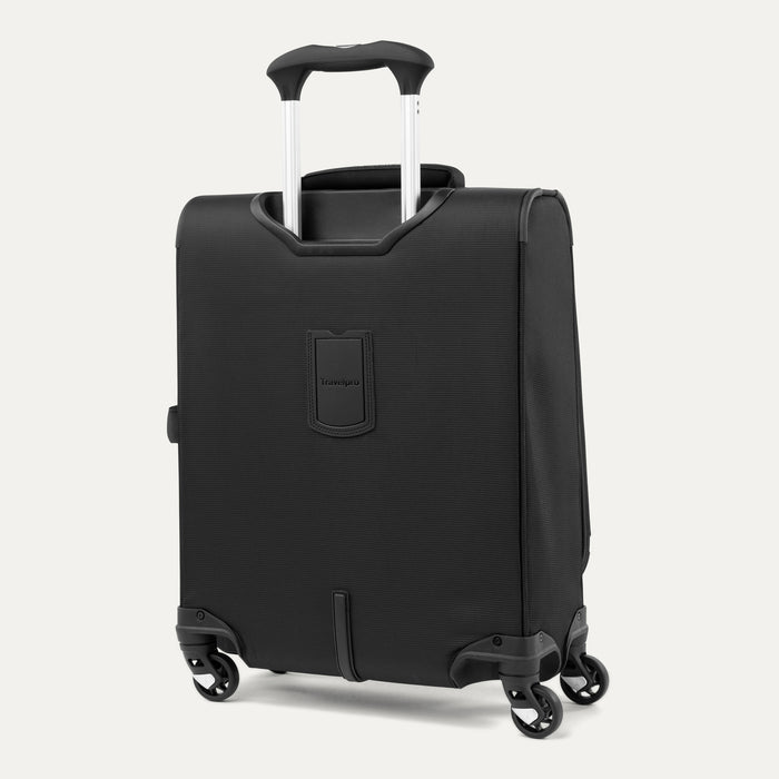 rear view of the black travelpro maxlite 5 international carry-on spinner showing the integrated rear stacking strap, four 360-degree rotating spinner wheels, and the fully extended powerscope lite handle.