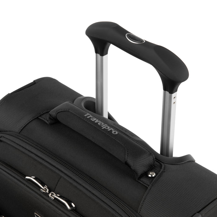 close-up view of the black travelpro maxlite 5 international carry-on spinner featuring the ergonomic contour grip on the powerscope lite handle and a cushioned top carry handle.